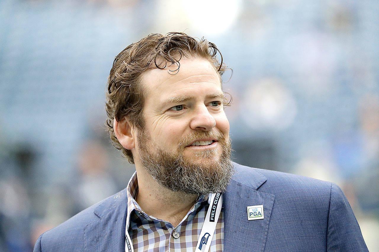 Seattle Seahawks general manager John Schneider walks on the field during warmups before a game against the Los Angeles Rams in October 2019 in Seattle. The Seahawks have agreed to a contract extension with Schneider that will keep him tied to the franchise through the 2027 draft. (Elaine Thompson/The Associated Press)