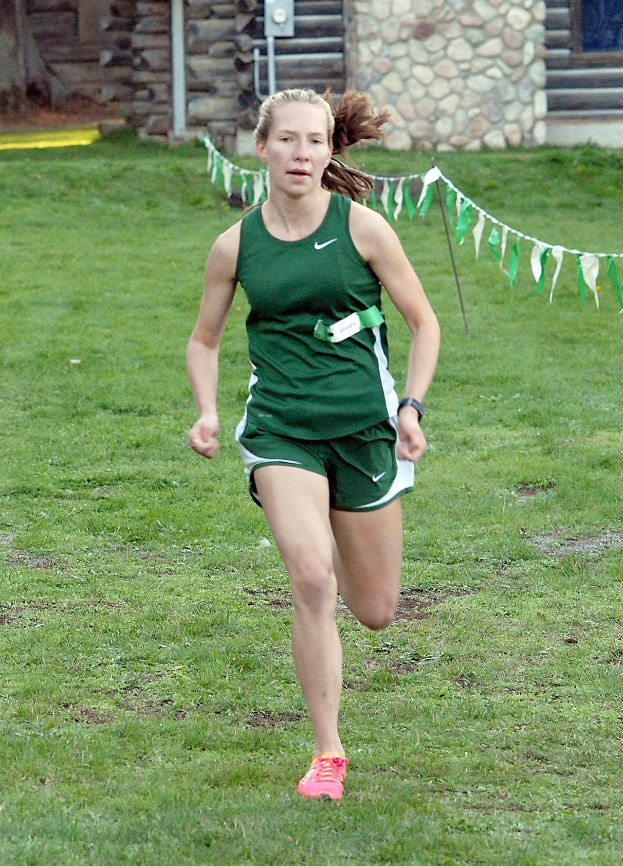 Lauren Larson of Port Angeles nears the finish line to win the girls cross country race at Lincoln Park in 2019. Larson, potentially a state-champion runner, gets a chance to lead her team back into competition Saturday after a nearly year-long hiatus of prep sports. (Keith Thorpe/Peninsula Daily News)