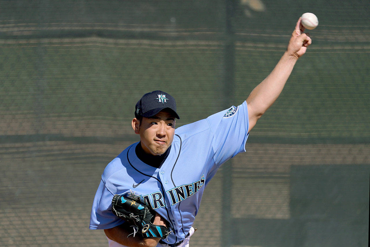 Seattle Mariners pitcher Yusei Kikuchi throws during baseball spring training Thursday, Feb. 25, 2021, in Peoria, Ariz. (Charlie Riedel/The Associated Press)