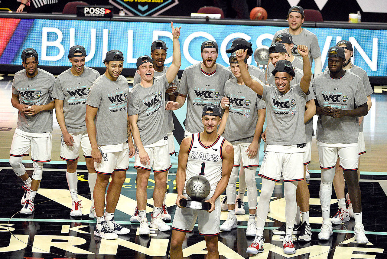 Gonzaga guard Jalen Suggs holds his tournament most outstanding player award after Gonzaga defeated BYU in an NCAA college basketball game in the West Coast Conference men's final, Tuesday, March 9, 2021, in Las Vegas. (AP Photo/David Becker)