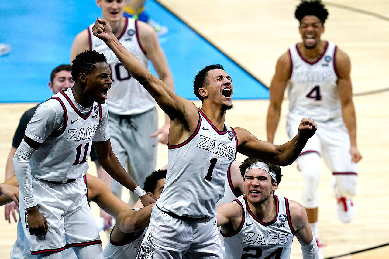 Gonzaga guard Jalen Suggs (1) celebrates making the game winning basket against UCLA during overtime in a men’s Final Four NCAA college basketball tournament semifinal game, Saturday, April 3, 2021, at Lucas Oil Stadium in Indianapolis. Gonzaga won 93-90. (AP Photo/Michael Conroy)