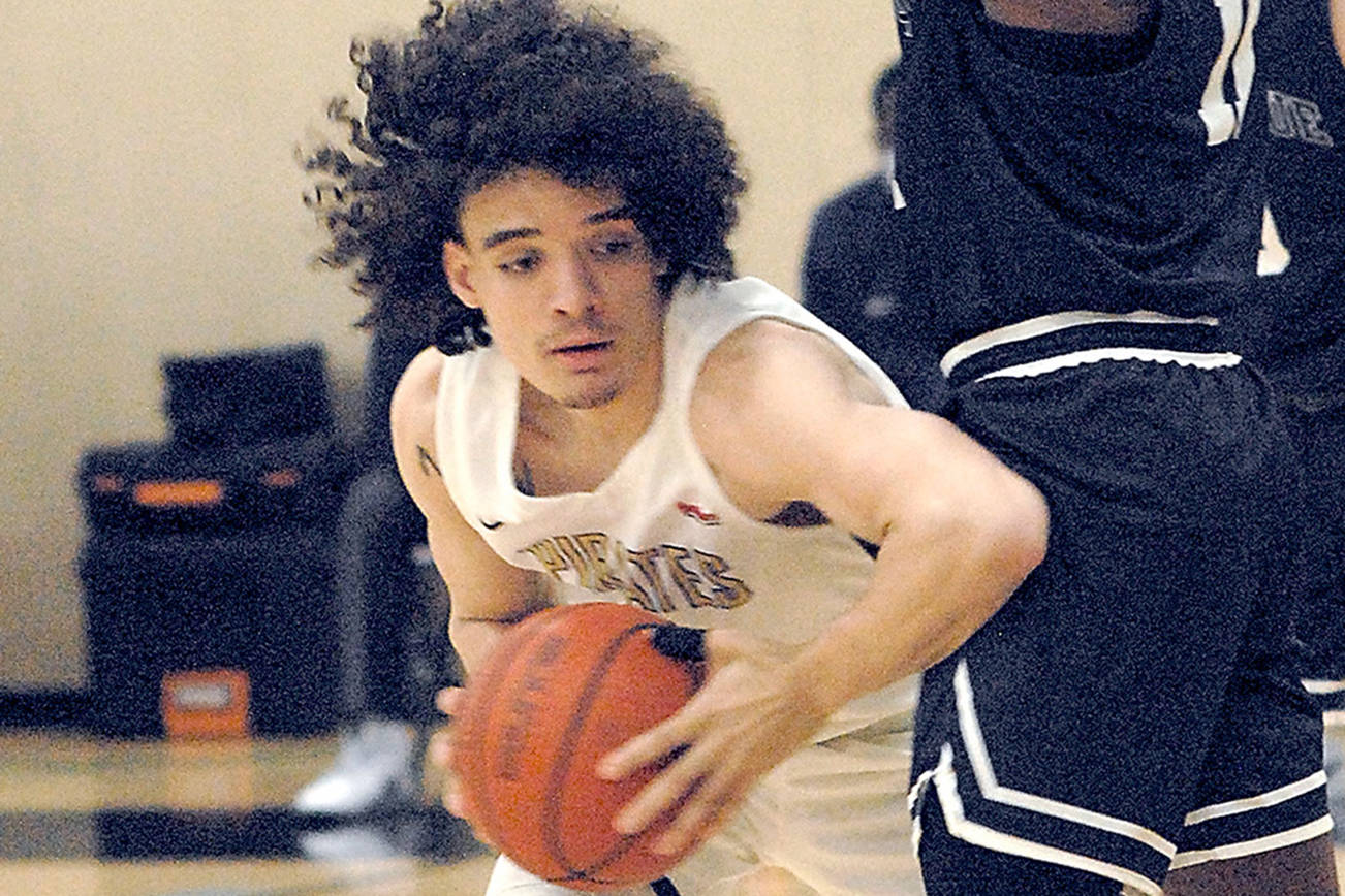 Keith Thorpe/Peninsula Daily News
Peninsula's KeAndre Hunter-Holiday, left,  leans past Bellevue's O'Landa Baker on Saturday afternoon in Port Angeles.
