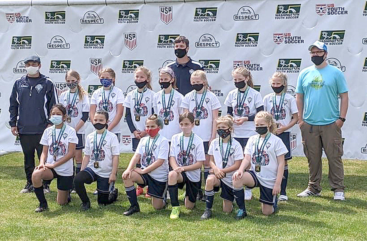 From left, back row, coach Jay Marazon, Stella Fradkin, Madison Wilkinson, Emma Desjardin, Maddie Walton, assistant coach Rob Walton, Mariah Traband, Alayna Marazon, Lilly Lancaster, and assistant coach Jack Waknitz. From left, front row, Brooklynn Schmidt, Madigan Ordona, Emma Rhodes, Cela Waknitz, Lila Nix and Peyton Smith. (Photo courtesy of Jessica Lancaster)