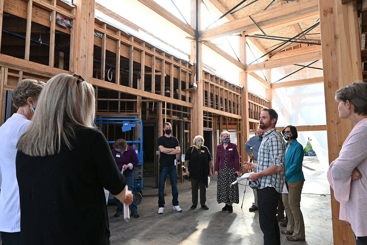 Dungeness River Audubon Center director Powell Jones, right, helps guide a tour of the center’s renovation to Sequim Sunrise Rotary Foundation board members. (Michael Dashiell/Olympic Peninsula News Group)