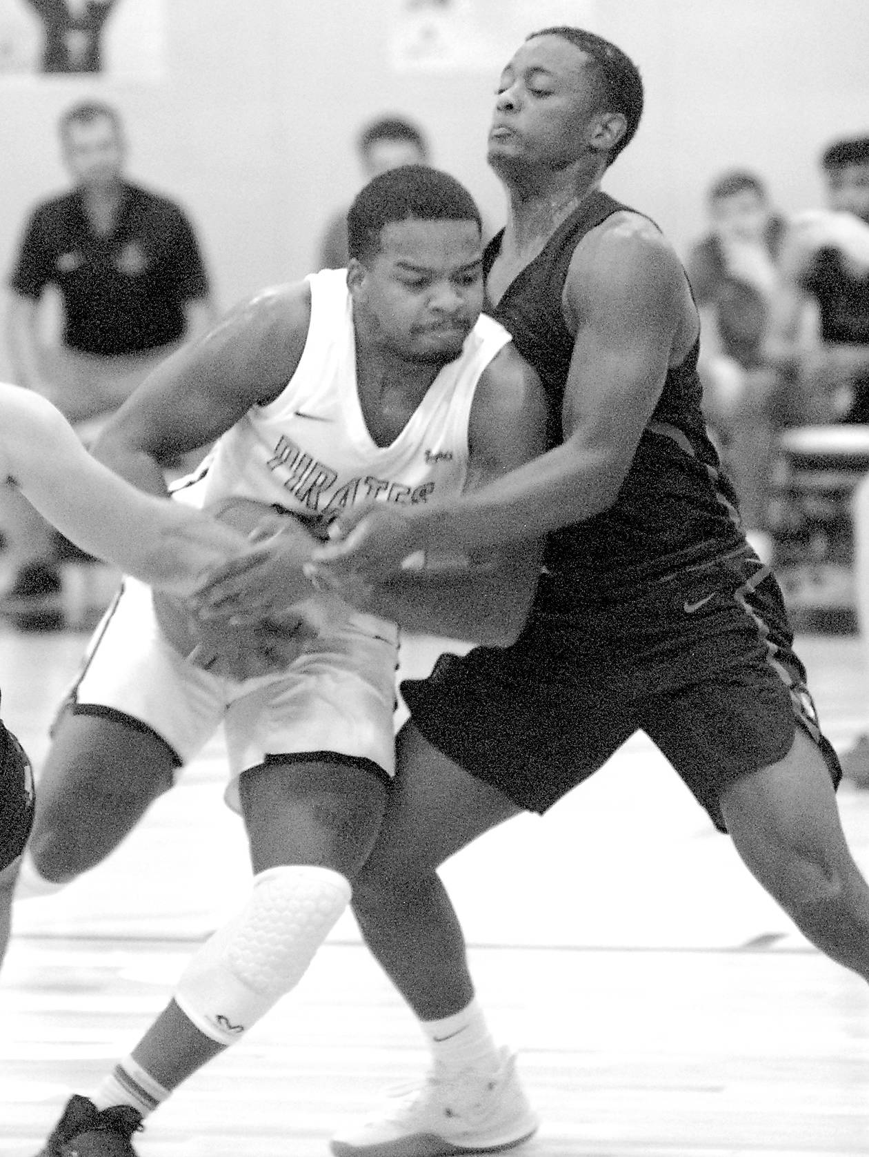 <strong>Keith Thorpe</strong>/Peninsula Daily News
Peninsula’s Keith Seldon shoulders past Everett’s Brycen Dillworth during the first half of Saturday’s game in Port Angeles.