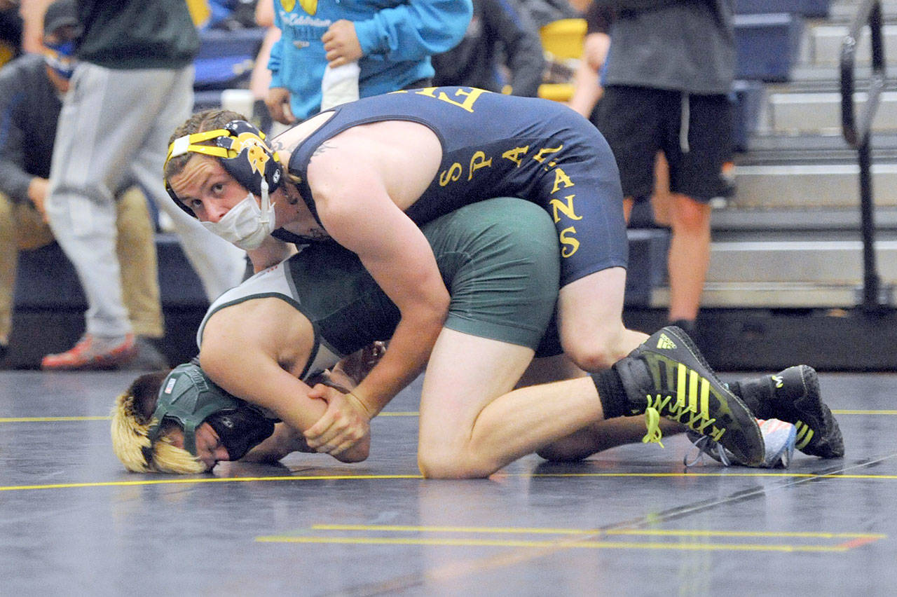 Forks’ Colton Duncan pinned Port Angeles’ Jack Harrelson in the 145-pound weight division Saturday at the Forks wrestling tournament. Duncan went on to win his weight class. (Lonnie Archibald/for Peninsula Daily News)