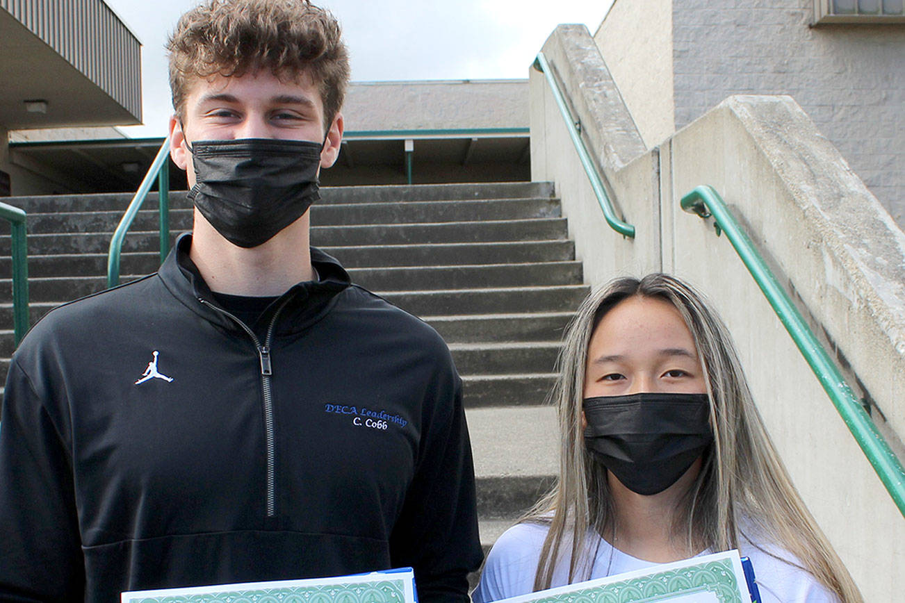 2021 Marketing Student of the Year Chase Cobb, on left, and 2021 Business Student of

the Year Abby Sanders.
