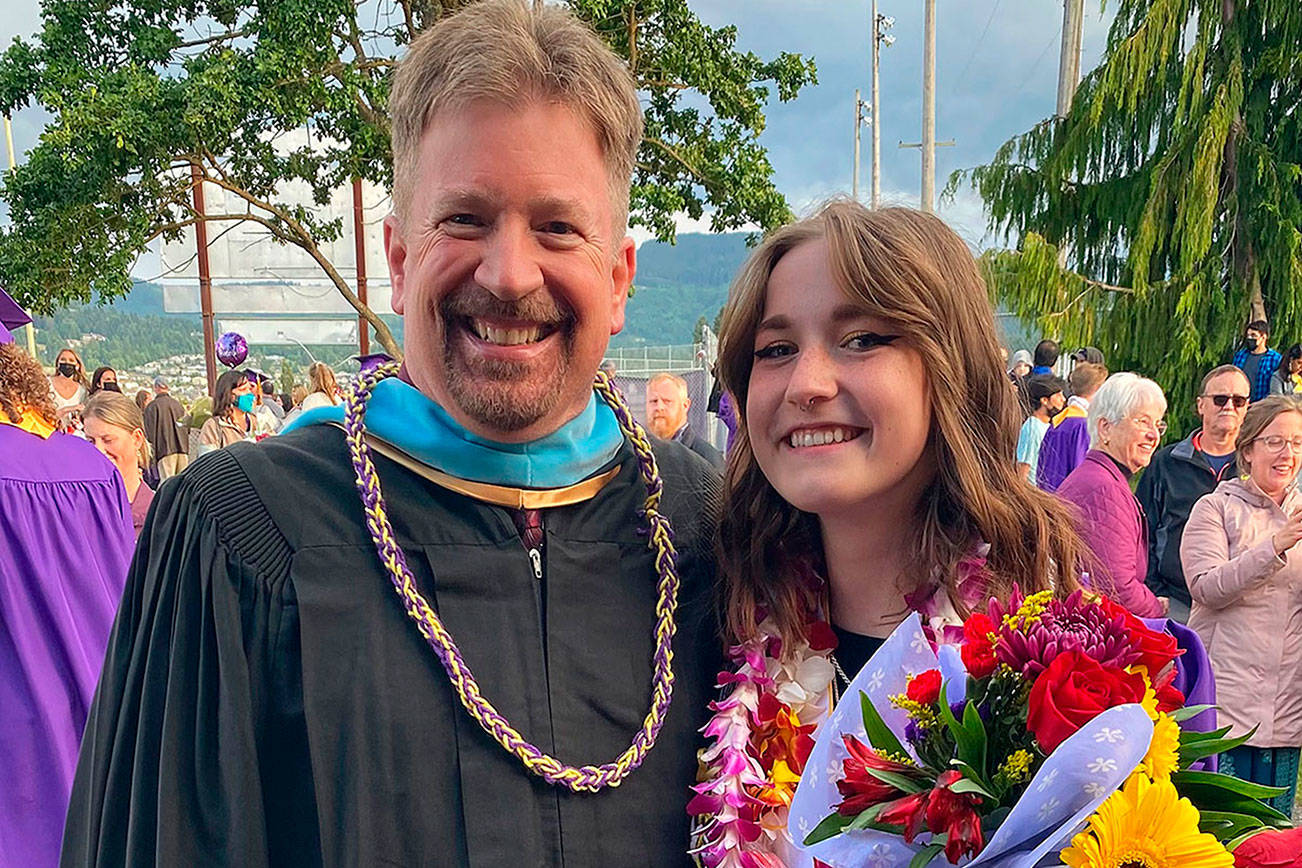 John Lorentzen visits with graduating senior Delaney Nucci after the Sequim High School 2021 graduation ceremony. (Photo courtesy of Nucci family)