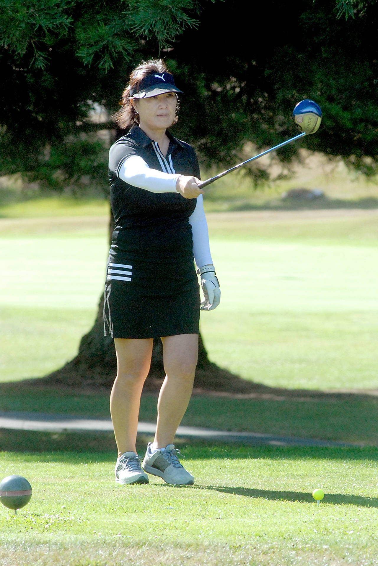 Yoon Park of Sequim takes aim on the first hole at Peninsula Golf Course at the start of Saturday’s Clallam County Amateur tournament. (Keith Thorpe/Peninsula Daily News)
