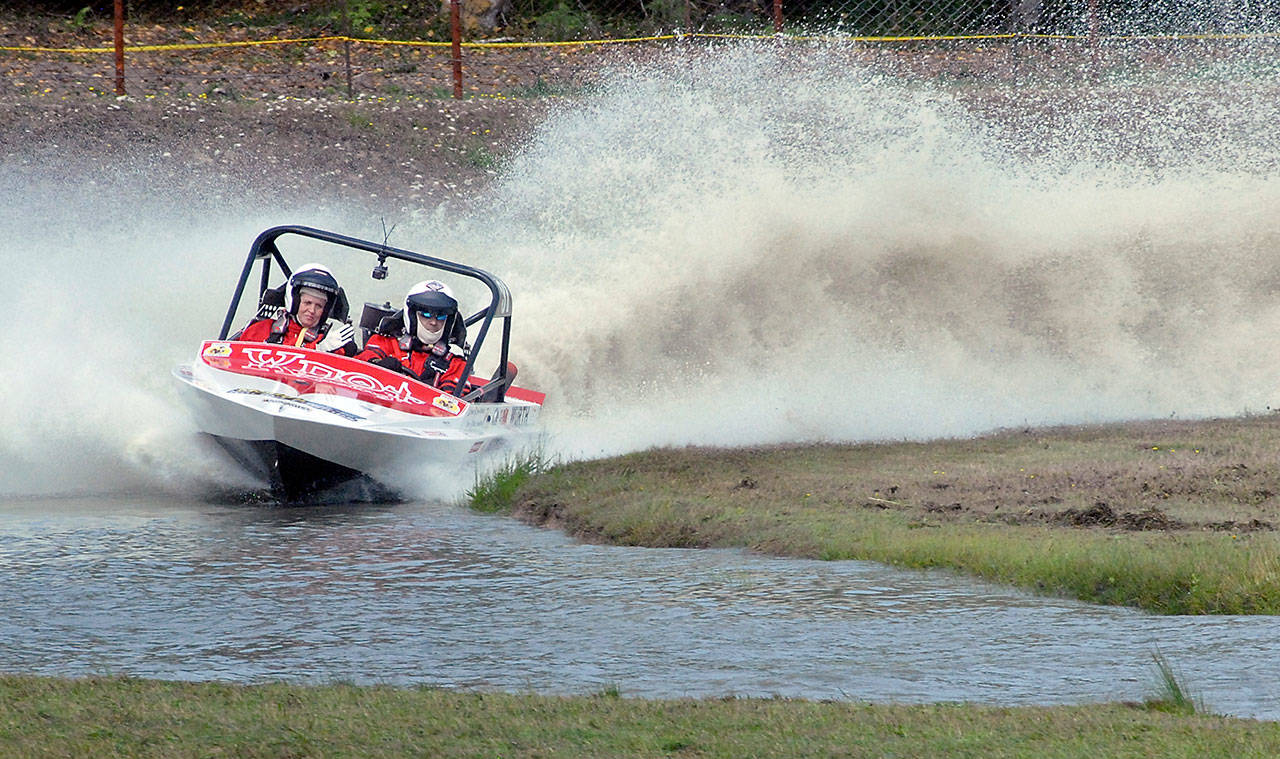 The Ynot Racing sprint boat team of navigator Jamie Johnson, left, and driver Dave Brown makes it way around the course in 2019 at Extreme Sports Park in Port Angeles. (Keith Thorpe/Peninsula Daily News)