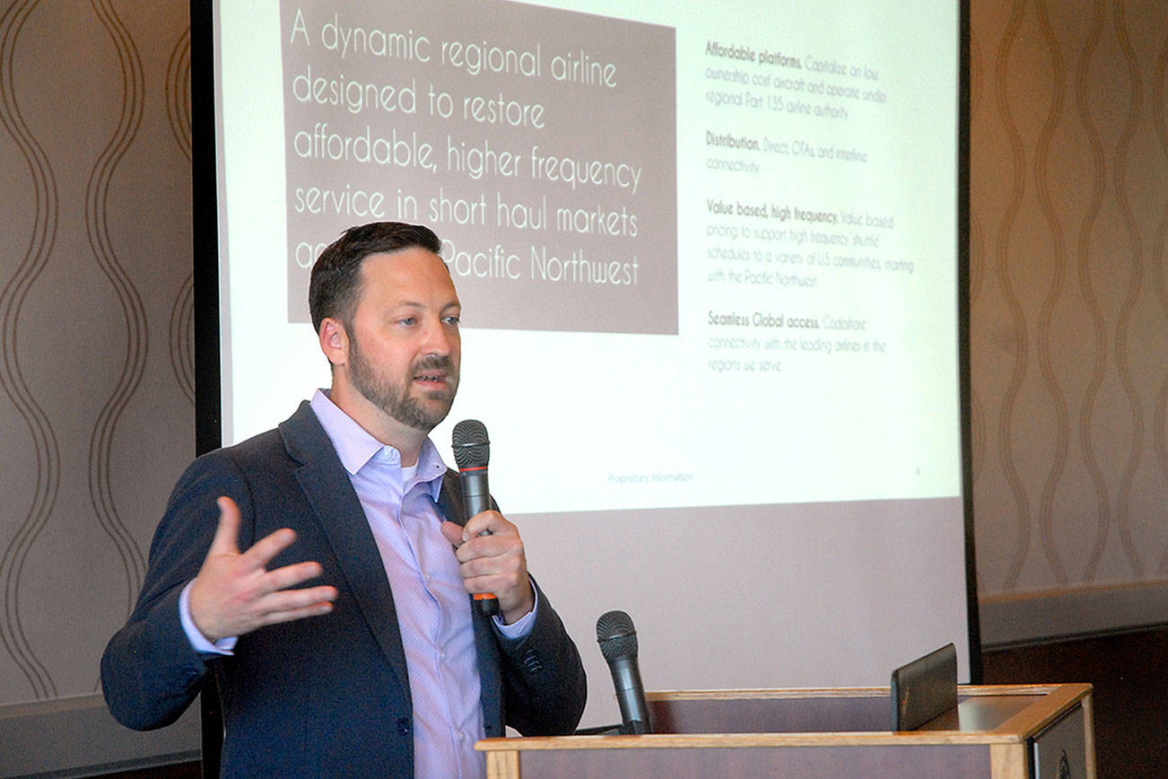 Clint Ostler, president of Dash Air Shuttle, speaks about starting air service between Port Angeles and Seattle-Tacoma International Airport during a Port Angeles Chamber of Commerce luncheon. (Keith Thorpe/Peninsula Daily News)