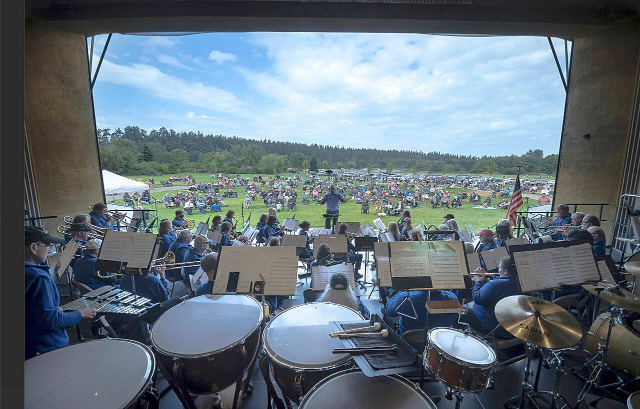 A view from the percussion section of the Sequim City Band, with director Tyler Benedict during the concert Aug. 22, 2021. Not visible are the tuba and percussion sections. (Jesse Major/Jesse Major Photography)