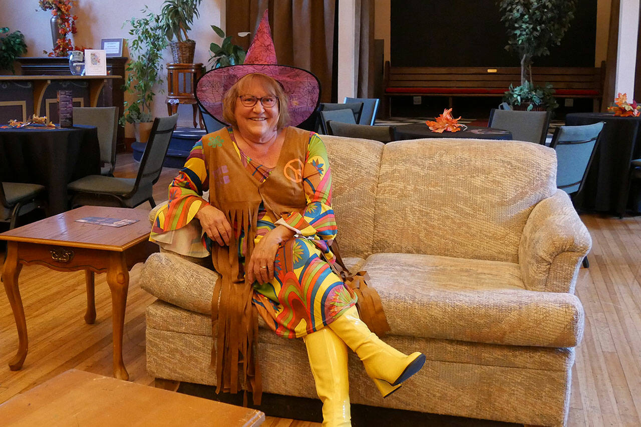 Star Pittman displays her costume for the evening in the Olympic Theatre Arts Center Gathering Hall. (Olympic Theatre Arts)