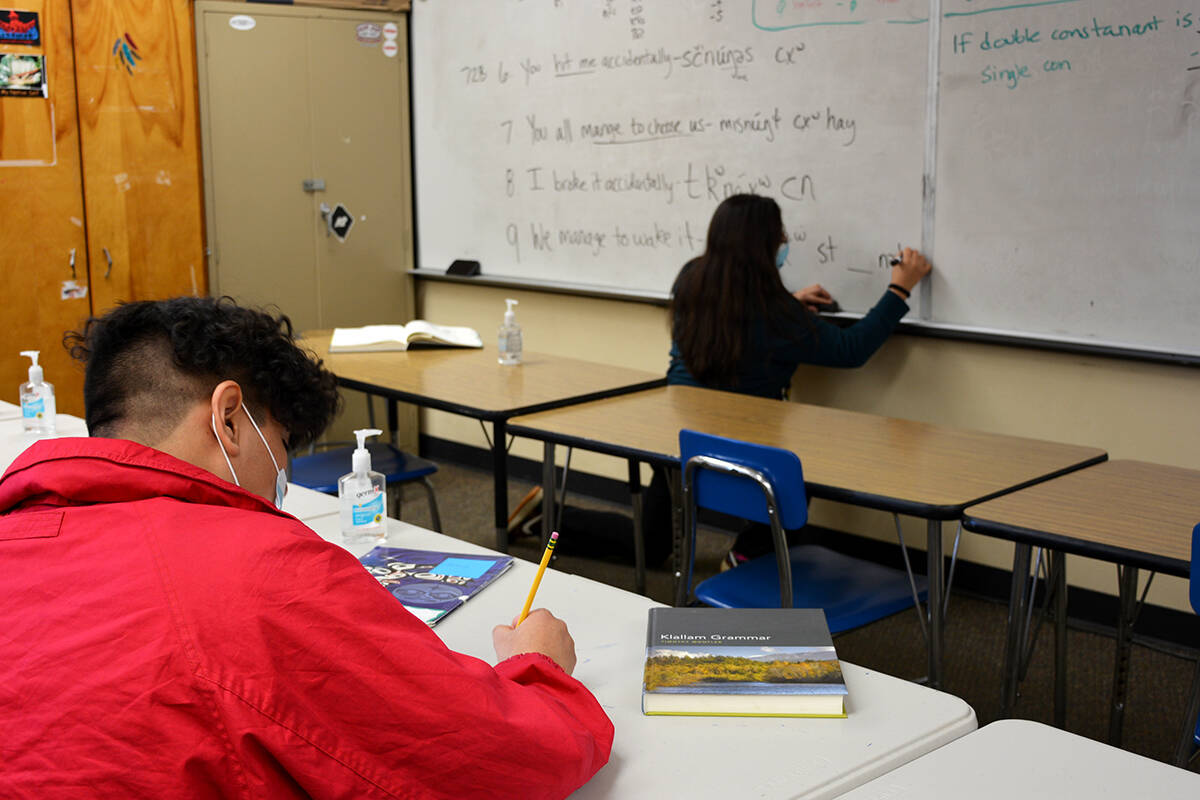 Wendy Sampson teaching Klallam language as student Antonio Martinez takes notes. This year, Wendy took a teaching position in the Port Angeles School District to continue the work of her predecessor and mentor, Jamie Valadez, teaching Klallam language.