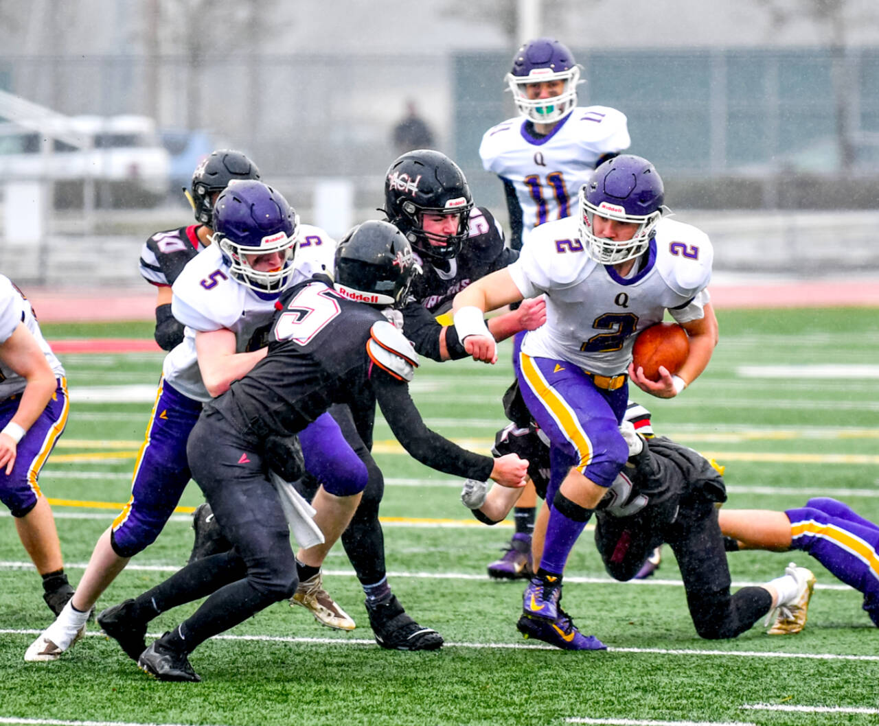 Bishop Budnek (2) runs the ball in the state 1B championship game against Almira-Coulee-Hartline. (Jim Wilkerson/for Peninsula Daily News)
