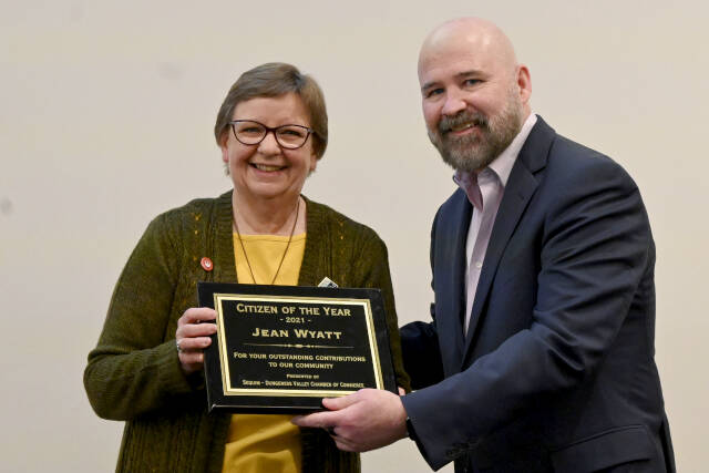 Michael Dashiell/Olympic Peninsula News Group
Longtime Sequim Irrigation Festival volunteer Jean Wyatt receives the 2021 Sequim Citizen of the Year honor from Terry Ward, publisher of the Peninsula Daily News and Sequim Gazette, on Tuesday at 7 Cedars Resort.