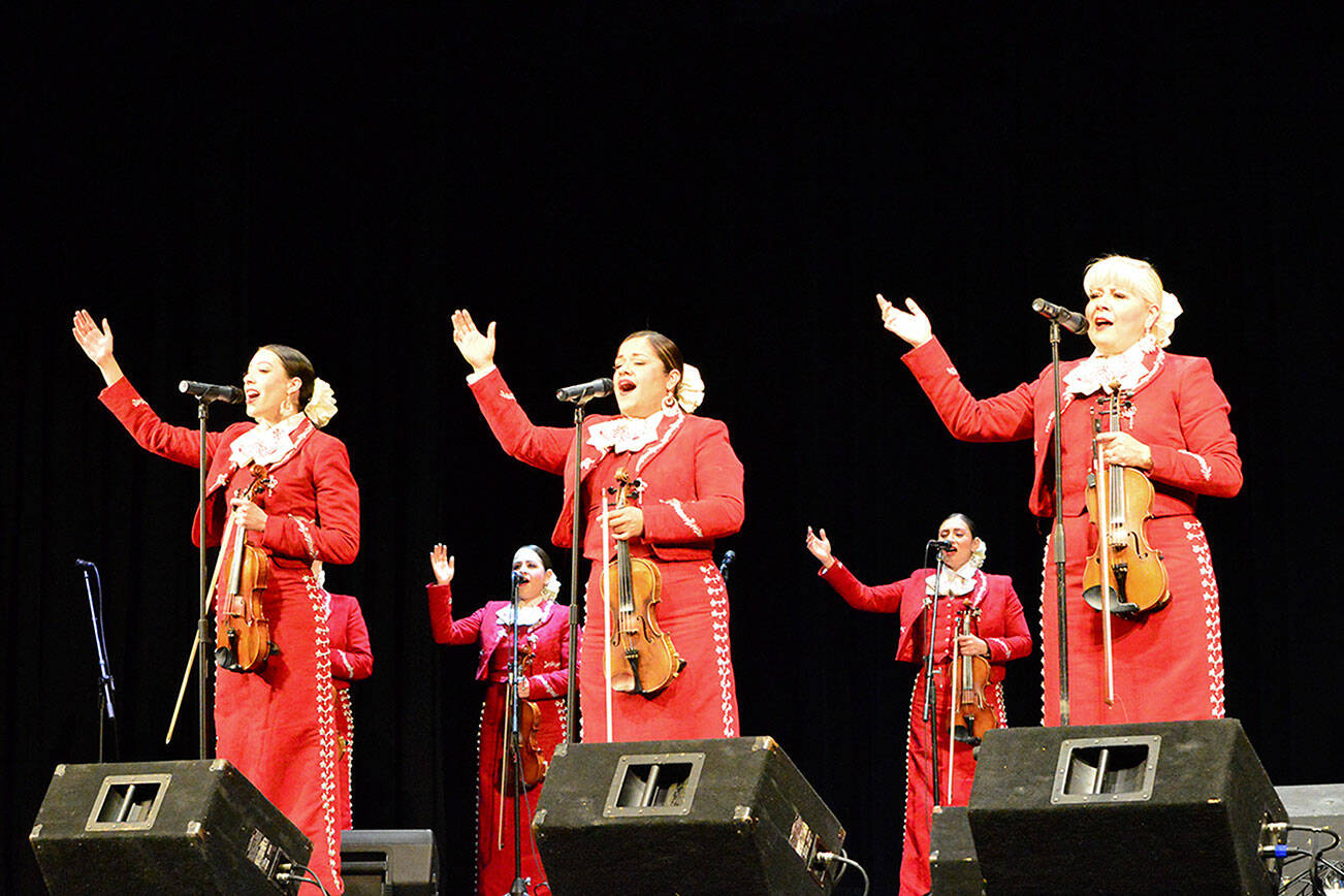 The women of Mariachi Reyna de Los Angeles sang in a Juan de Fuca Foundation for the Arts concert last week at the Port Angeles High School Performing Arts Center. Diane Urbani de la Paz/Peninsula Daily News