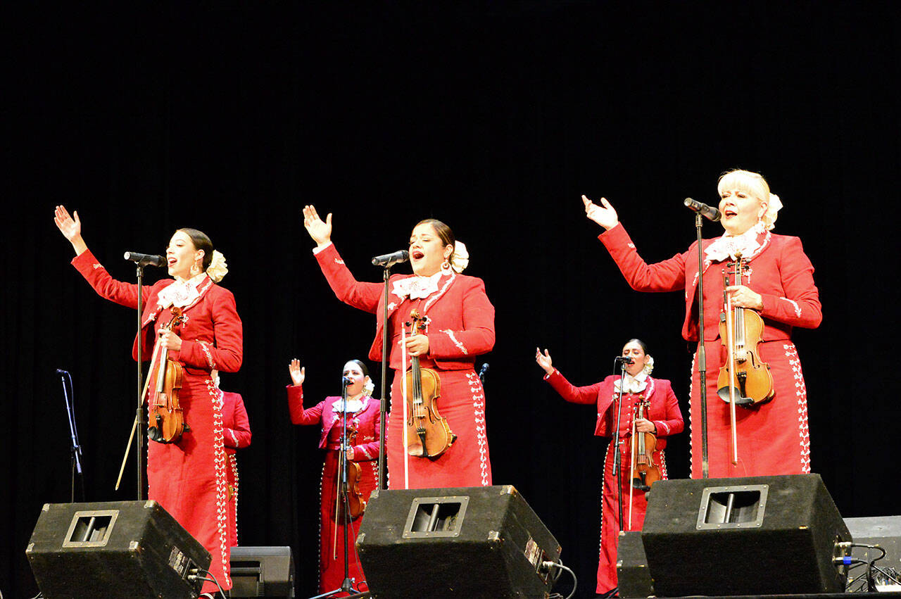 The women of Mariachi Reyna de Los Angeles sang in a Juan de Fuca Foundation for the Arts concert last week at the Port Angeles High School Performing Arts Center. (Diane Urbani de la Paz/Peninsula Daily News)