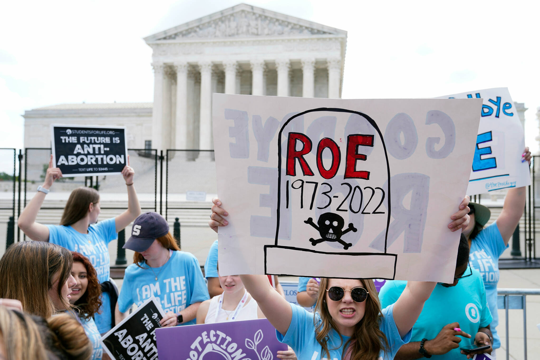 Demonstrators protest the ruling outside the Supreme Court in Washington, D.C., on Friday. (Jacquelyn Martin/The Associated Press)