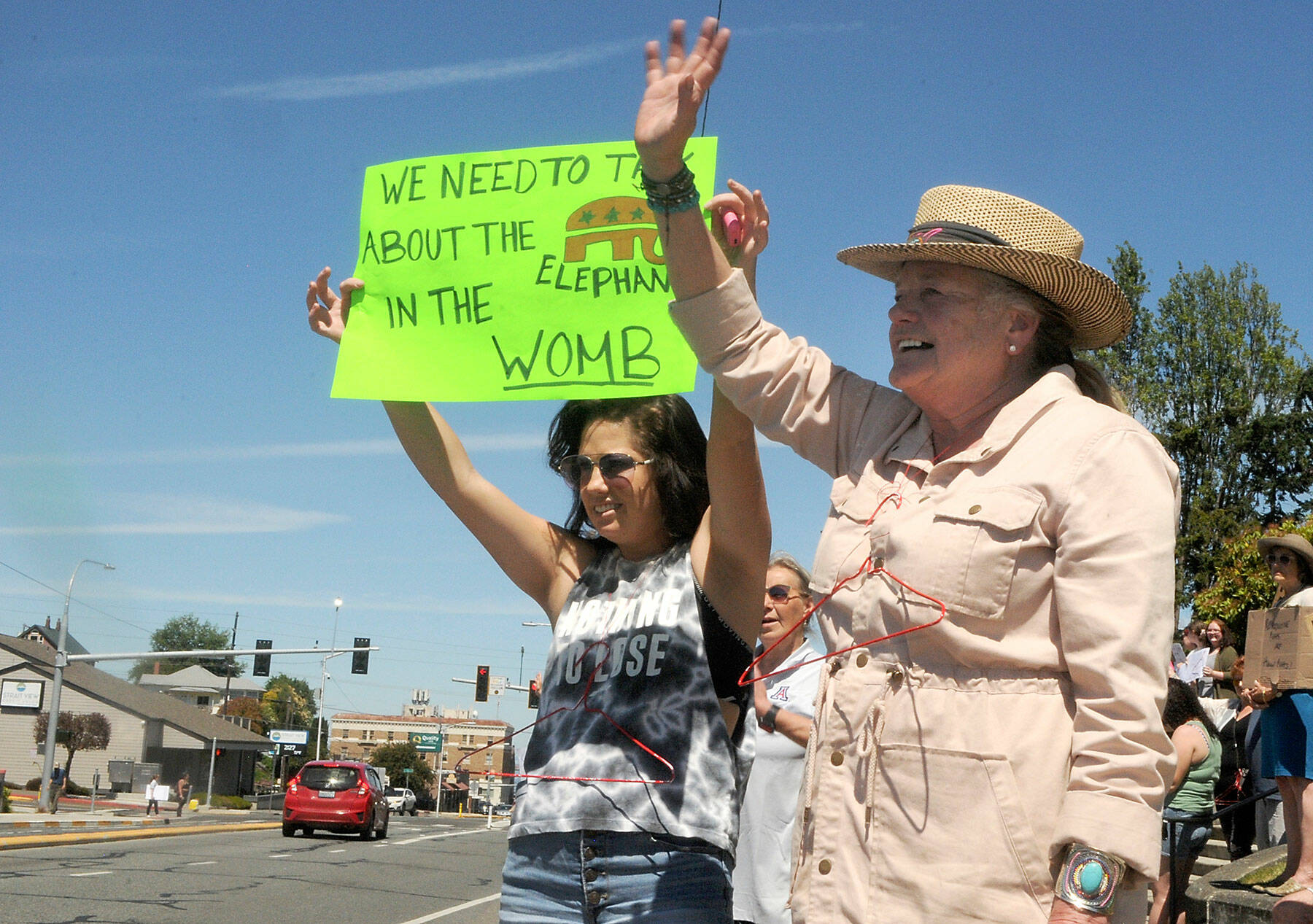 Hilary Soderling of Kirkland, left, and her mother, Lou Ann Soderling of Port Angeles, participate in Saturday’s rally at the Clallam County Courthouse. (Keith Thorpe/Peninsula Daily News)