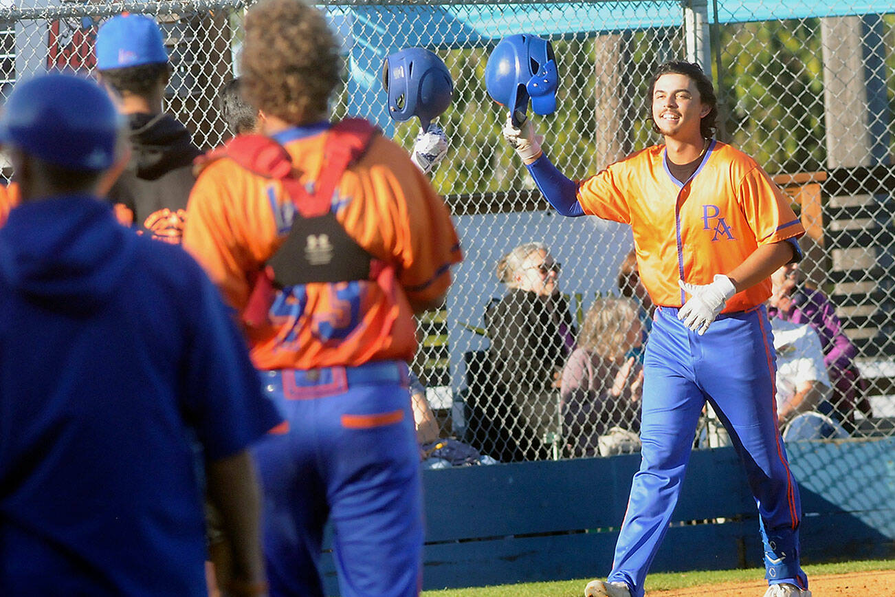 Keith Thorpe/Peninsula Daily News
Lefties designated hitter Riley Parker tips his helmet at his teammates after rounding the bases with a solo homer in the first inning on Thursday night at Port Angeles Civic Field.