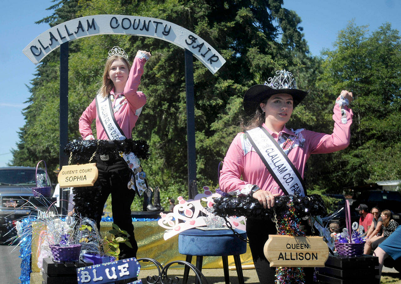 Fair Queen Allison Pettit, front, and Queen’s Court Sophia Lawson, shown on Aug. 6 on their parade float in the Joyce Daze Wild Blackberry Festival, will preside over the Clallam County Fair starting on Thursday in Port Angeles. (Keith Thorpe/Peninsula Daily News)