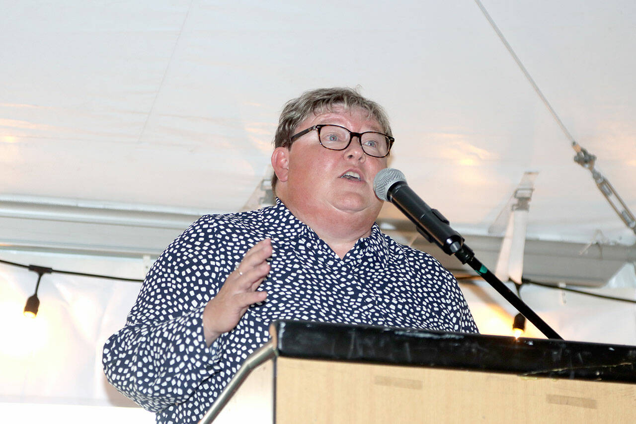 Marcia Isenberger, a three-sport star at Port Angeles High School who went on to become the top tennis player at Eastern Washington, speaks at the Roughrider Hall of Fame dinner Saturday night. (Dave Logan/for Peninsula Daily News)
