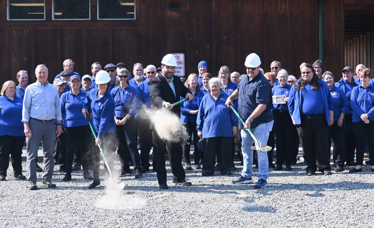 Michael Dashiell / Olympic Peninsula News Group
Sequim City Band members break ground on the rehearsal hall expansion project. Pictured with ceremonial shovels are, from left, band president Debbi Soderstrom, band director Tyler Benedict and Neeley Construction superintendent Eli Collier.