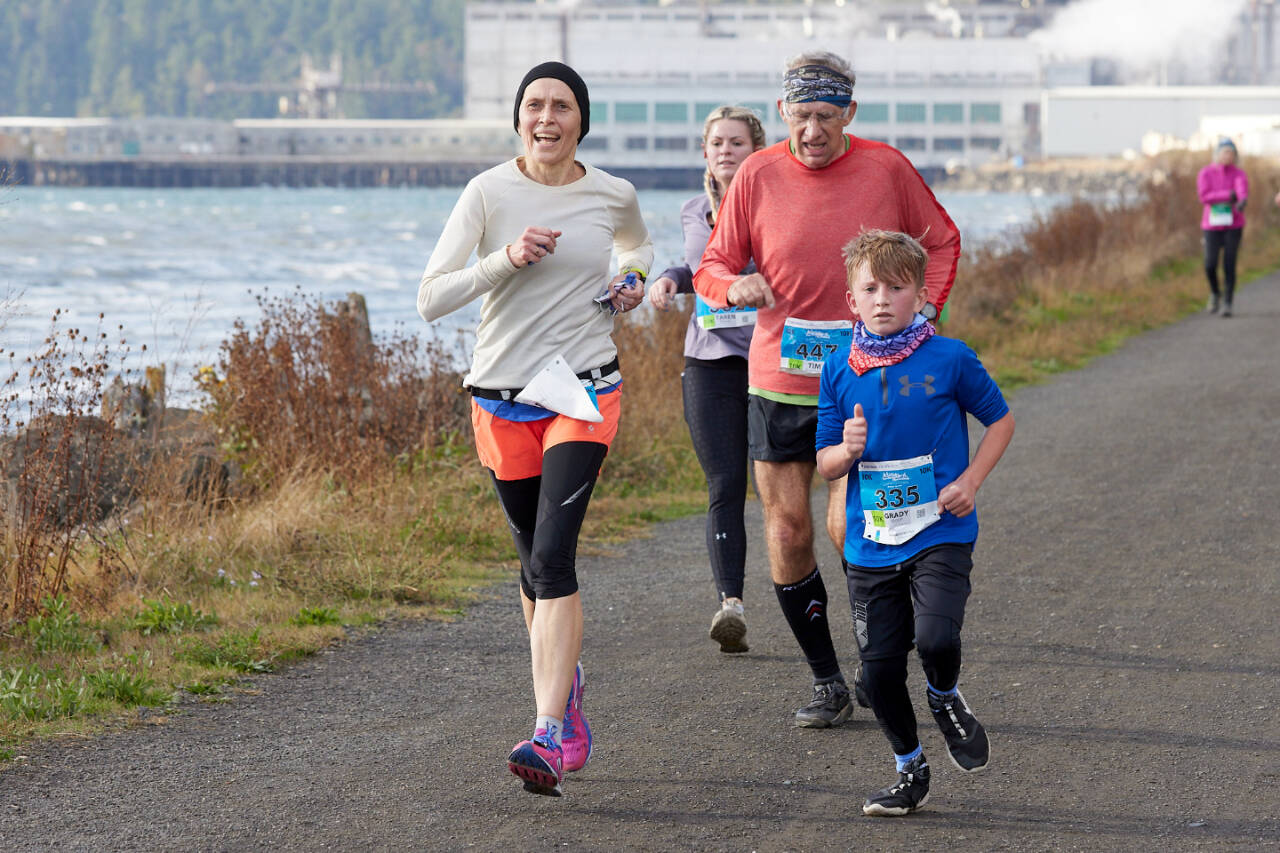 Grady Moon (335), Tim Branham (447), Taren Reaves (362) and another runner compete in the Larry Scott Trail Run in 2021 in Port Townsend. (Port Angeles Marathon Association)
