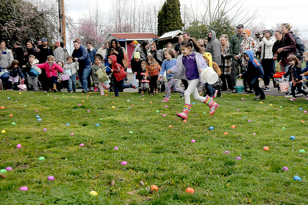 Children bolt from the starting line in search of treat-filled eggs during Saturday’s 45th annual KONP Easter Egg Hunt at the Clallam County Fairgrounds in Port Angeles. Hundreds of youngsters took part in the event. (Keith Thorpe/Peninsula Daily News)