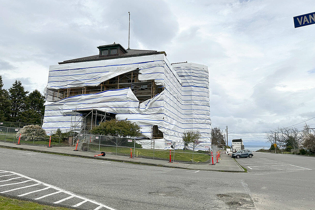 The post office building in Port Townsend, covered with protective plastic while undergoing renovation work, is buffeted by gale force winds on Sunday strong enough to rip the covering. (Steve Mullensky/for Peninsula Daily News)