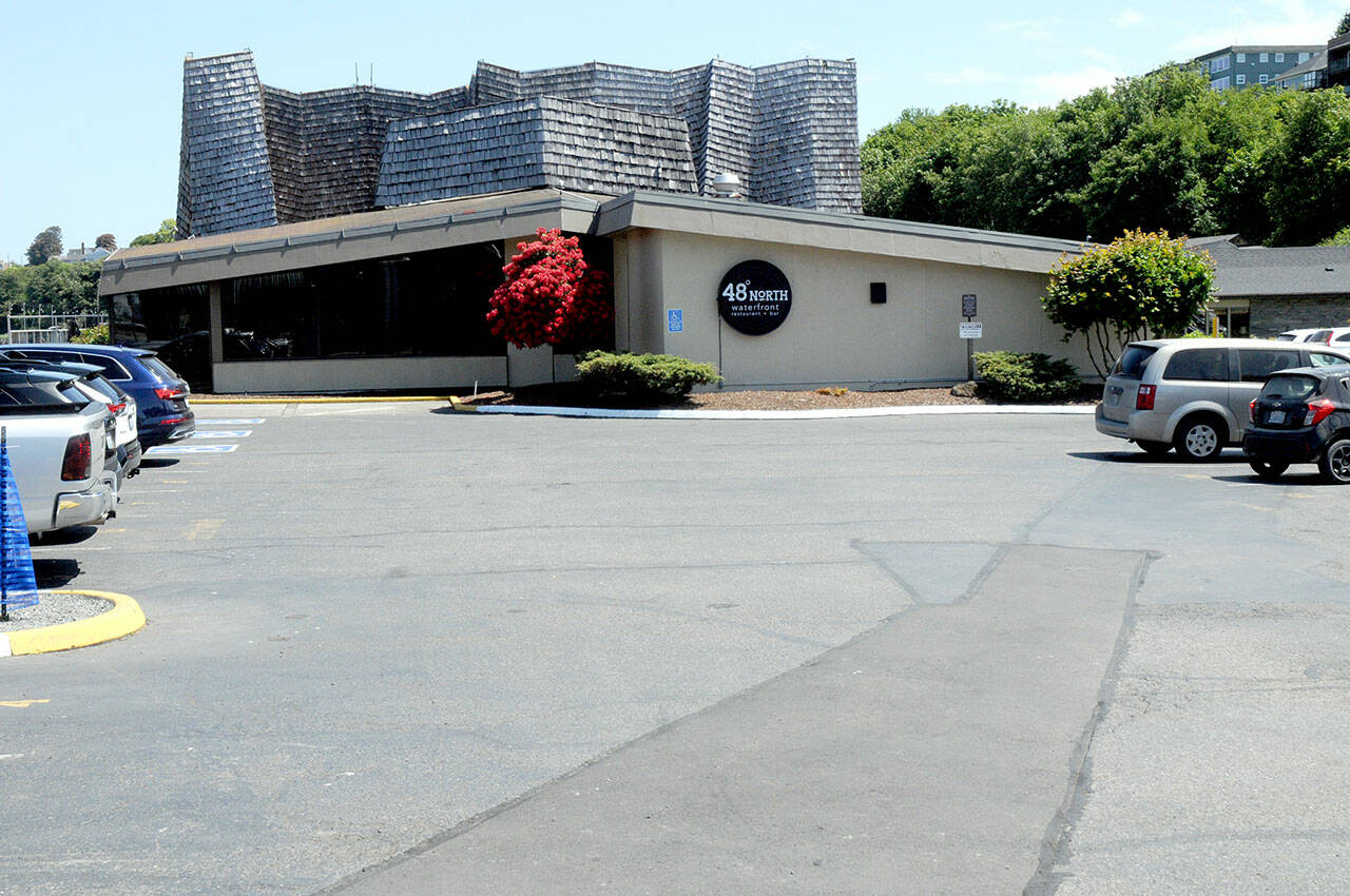 KEITH THORPE/PENINSULA DAILY NEWS
The Port Angeles Red Lion Hotel and adjoining 48º North Waterfront Restaurant, shown Friday, are working on plans to expand and upgrade the current facilities, which will include incursion into the existing parking lot -- a proposal that would have an effect on the annual Port Angeles Crab Festival.