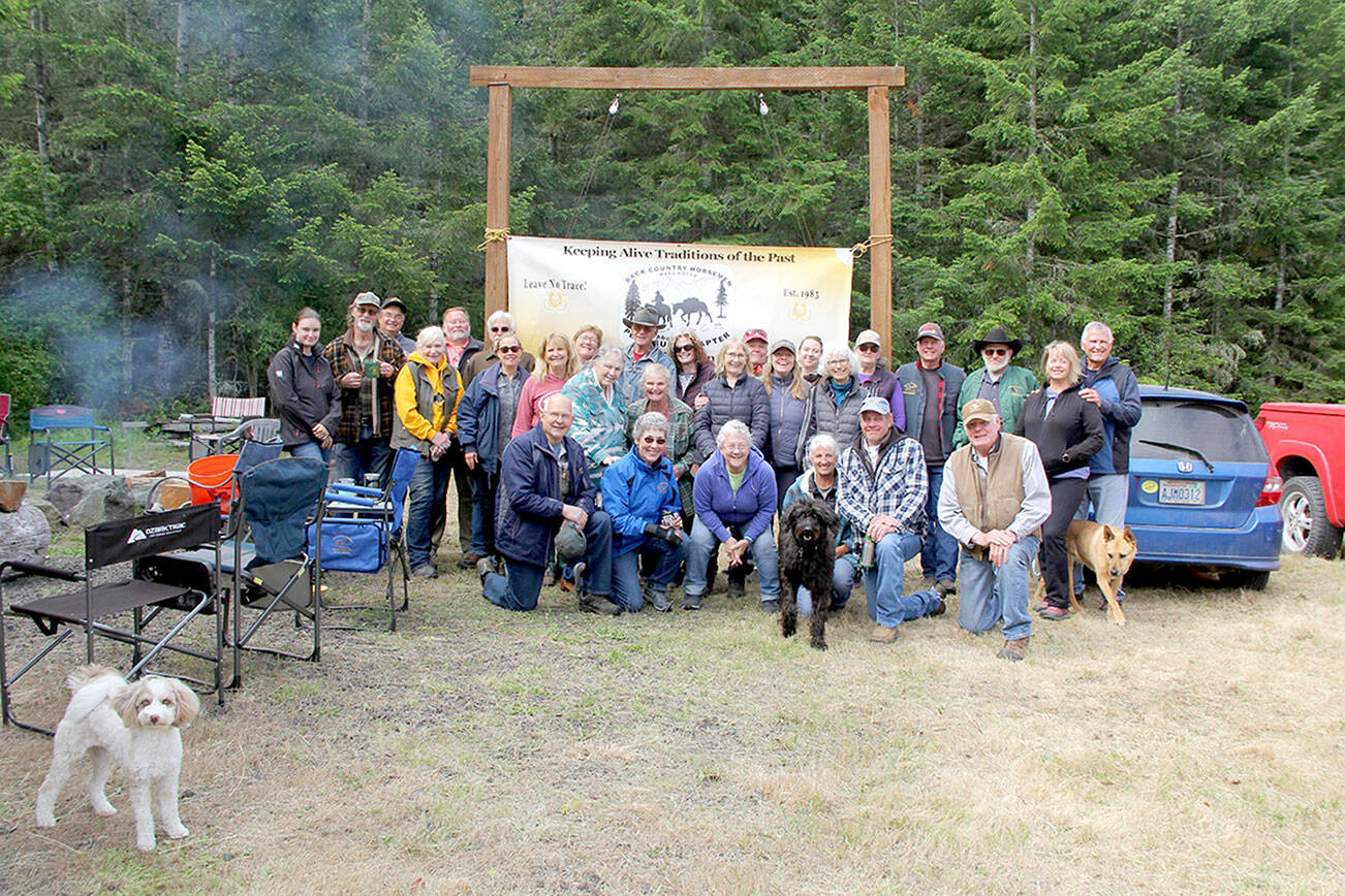 Photos by Karen Griffiths

 

Cutline: Members of the Peninsula Chapter of Back Country Horseman gathered for at Miller Peninsula State Park for a pre-ride breakfast before hitting the trails for its annual Rhody Ride. The state’s official flower, the pink flowered Pacific Rhododendron, R. macrophyllum, was in full bloom.