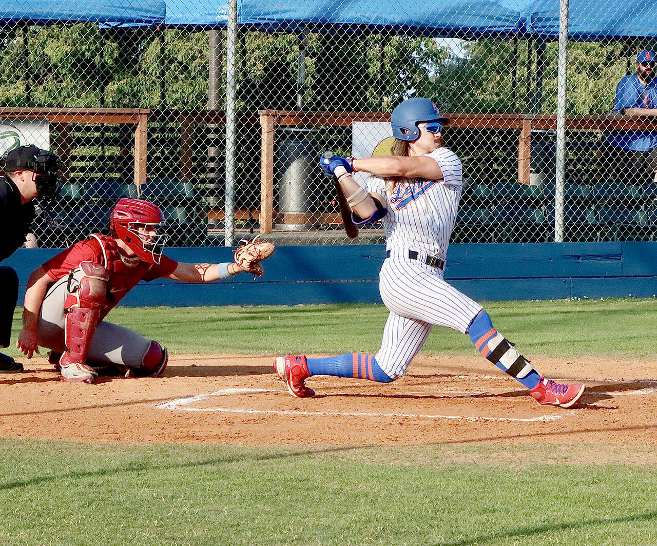 Dave Logan/for Peninsula Daily News Port Angeles’ Trent Jackson follows through on a single into right field during the Lefties’ series-winning 3-2 victory over Wenatchee on Thursday at Civic Field.