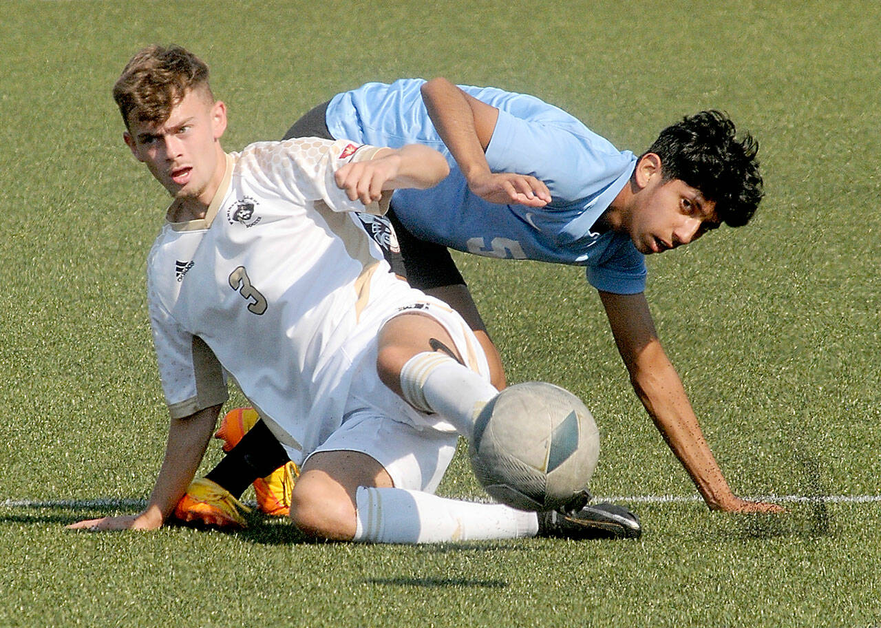 Peninsula’s Alfie Tucker front, gets tangled on the pitch with Pierce’s Manuel Lomeli during Saturday’s match at Wally Sigmar Field.