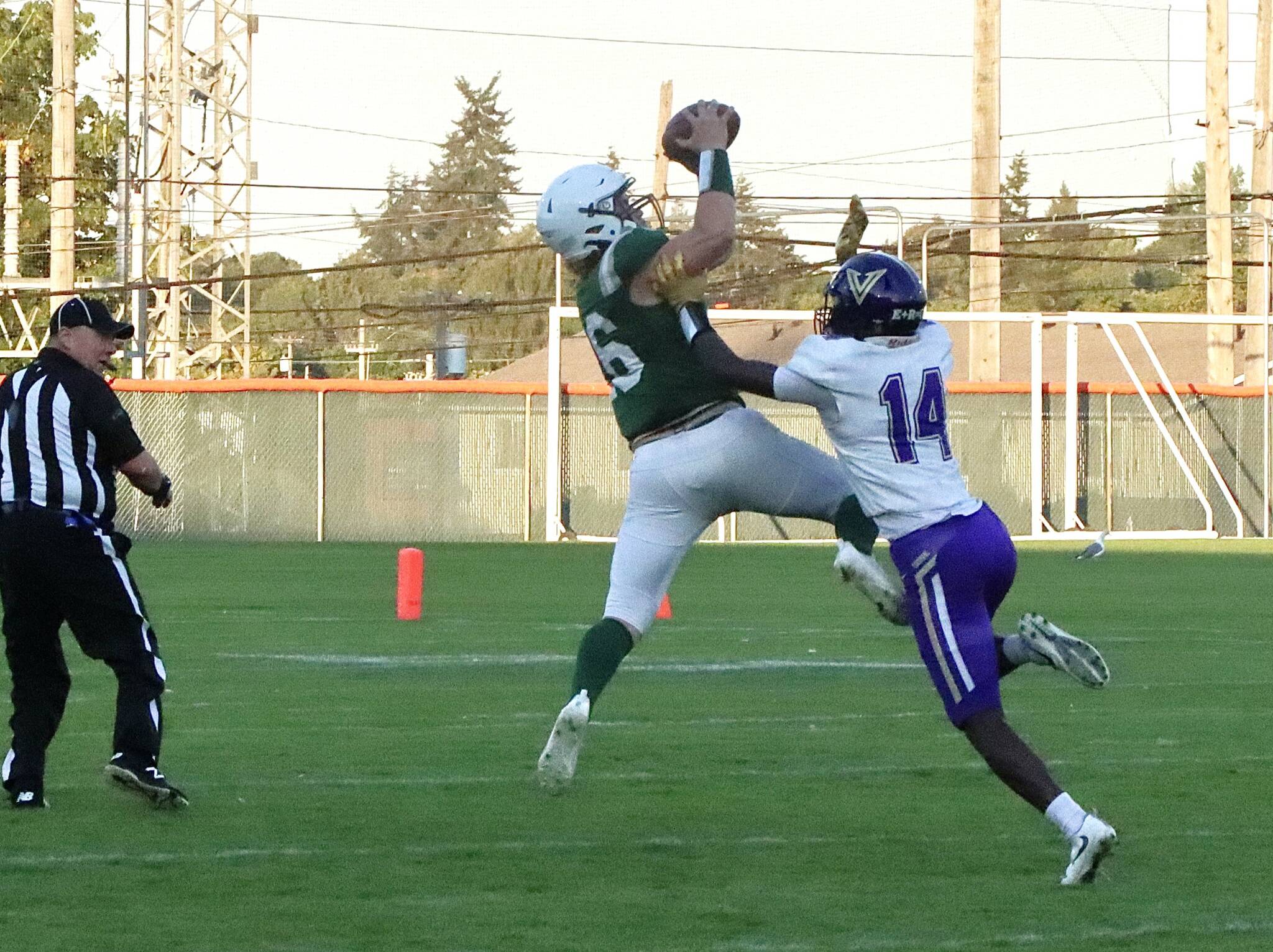 Port Angeles’ Landyn Jones goes up to haul in a 35-yard pass from quarterback Parker Nickerson in the first quarter Friday night at Civic Field in Port Angeles. The catch helped lead to a touchdown pass to Ezra Townsend on the next play. (Dave Logan/for Peninsula Daily News)