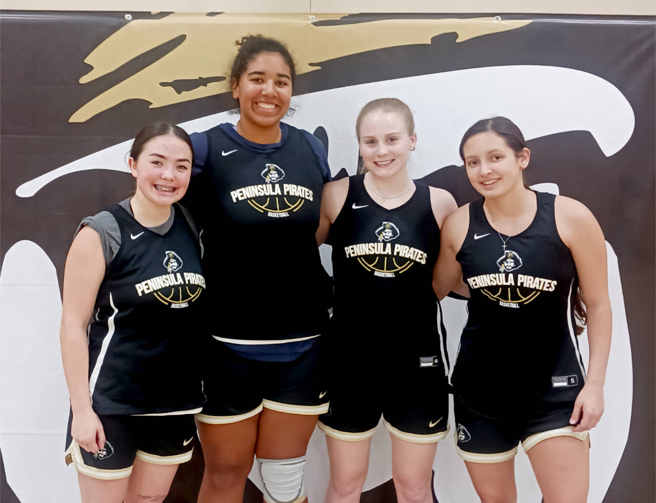 From left, Hannah Bates and Jelissa Julmist, both of Sequim, Kadie Wood of Forks and Allie Greene of Neah Bay are part of a core group of Olympic Peninsula players for the Peninsula College Pirates. (Pierre LaBossiere/Peninsula Daily News)