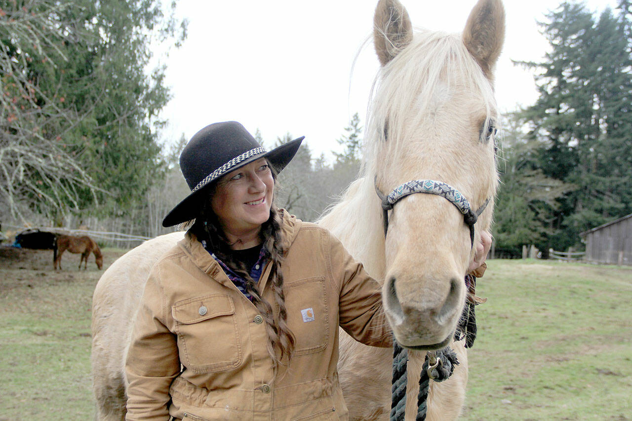Kix, an older BLM mustang from in Oregon, arrived at Paradise Waits Mustang Sanctuary completely fearful of people after his previous owner mistreated and abandoned him. After a veterinarian exam discovered the horse is blind PWMS operator Vanessa Lowe said, “Now that he’s understood he’s the sweetest horse and great with the kids that come to visit.” (Karen Griffiths/For Peninsula Daily News)