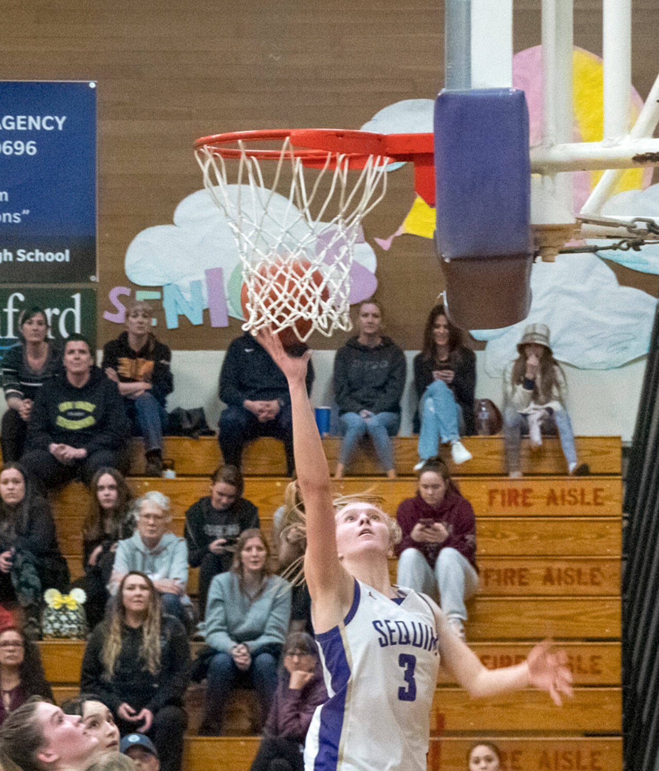 Sequim’s Jolene Vaara goes to the rim during a 2022-23 contest. Vaara won the Olympic League MVP and Defensive Player of the Year honors while guiding the Wolves to a league title. (Emily Matthiessen/Olympic Peninsula News Group)