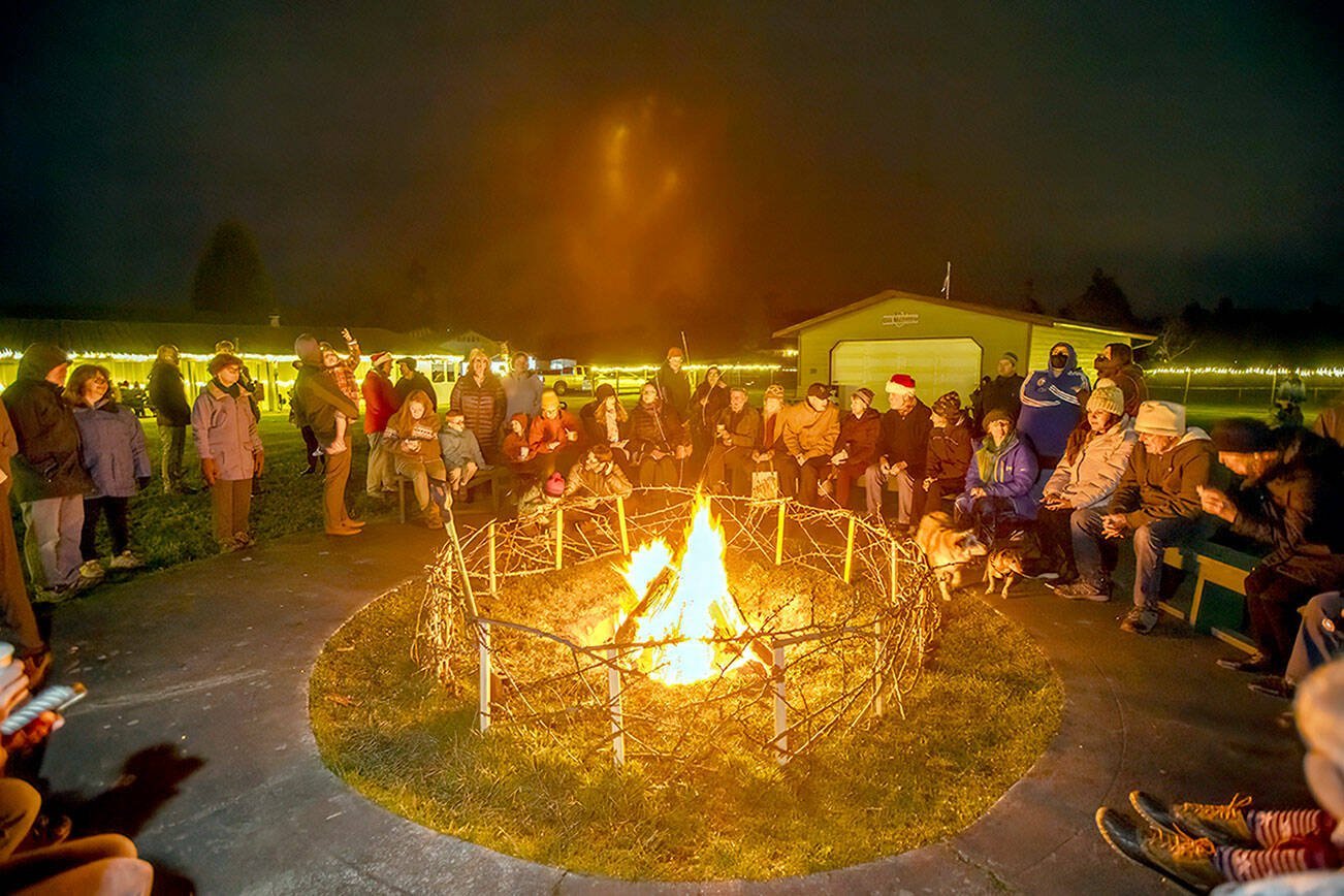 Steve Mullensky/for Peninsula Daily News

Several hundred people took advantage of a warming bonfire on the night of the Winter Solstice at the Jefferson County Fairgrounds on Thursday night. Stews by Chef Arran Stark, music, tractor rides, a market and fire dancing were offered alng with the crowing of a solstice queen/king.