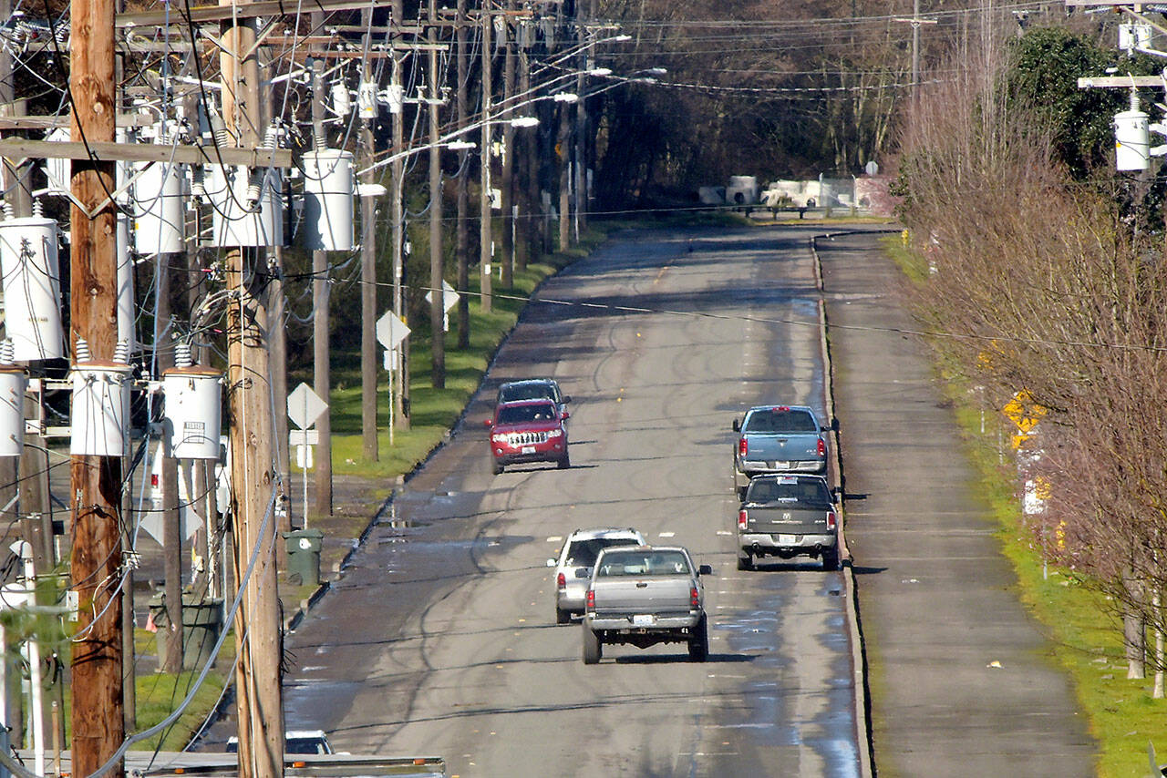 Marine Drive in Port Angeles, shown Tuesday, is slated for repaving this summer to replace the aging and frequently-patched road surface. (KEITH THORPE/PENINSULA DAILY NEWS)