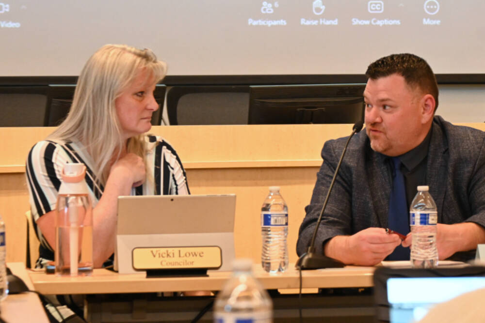 Sequim City Council member Vicki Lowe and Sequim School Board president Eric Pickens talk at a joint meeting at the city council’s chambers on June 25. (Michael Dashiell/Olympic Peninsula News Group)