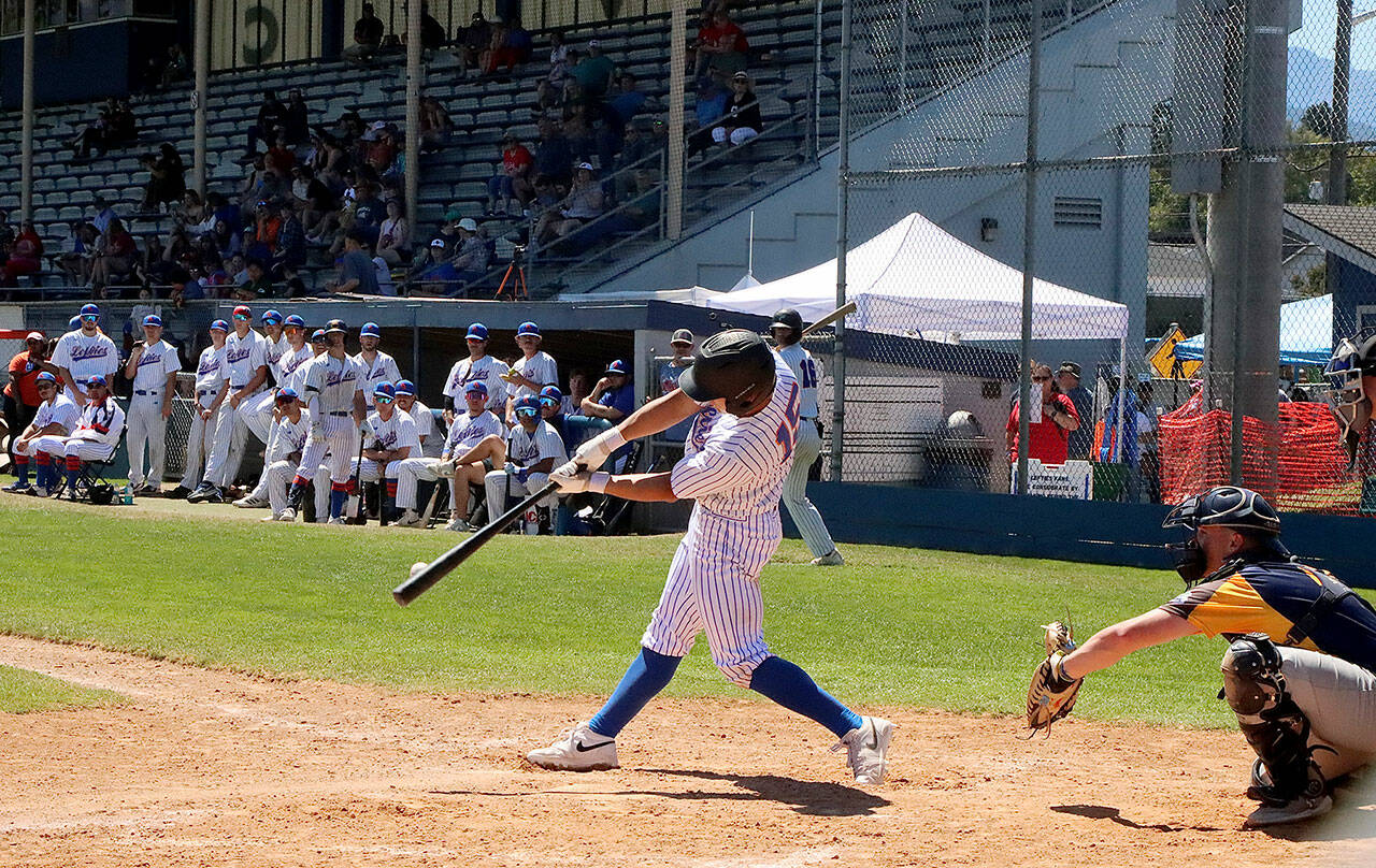 Dave Logan/for Peninsula Daily News
Port Angeles' Matt Blair gets the bat on the ball in the third inning of their game against the Nanaimo NightOwls. His teammates and fans in the stands at Civic Field watch for a good result at the plate as they celebrate the Fourth of July at the ballpark.