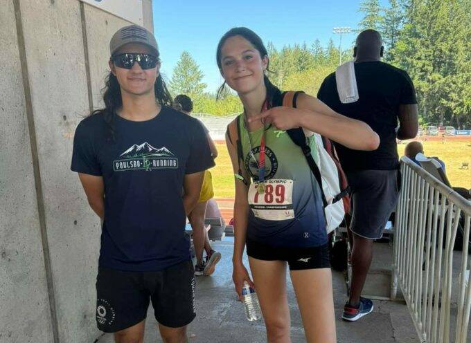 Photo by Kirsti Turella 
Clare Turella celebrates with high jump coach Ten Gordon after Turella won the Region 13 high jump championship in Gresham, Oregon, earlier this month. Turella, who will be a sophomore at Sequim High this fall, earned a spot in the Junior Olympic Championships in August.