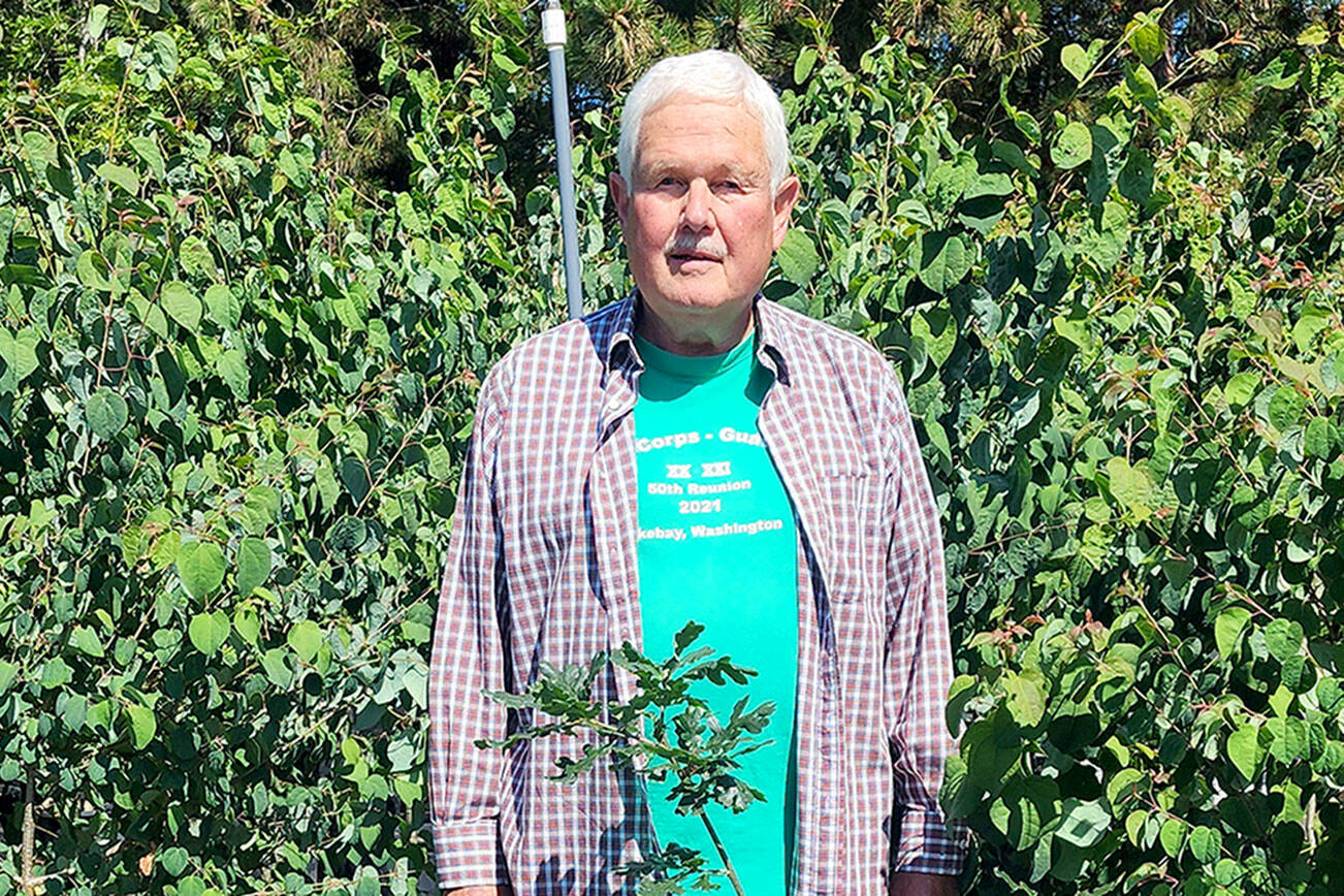 Mr. Forest stands with the actual  trees that will be available in the city tree shade  program.