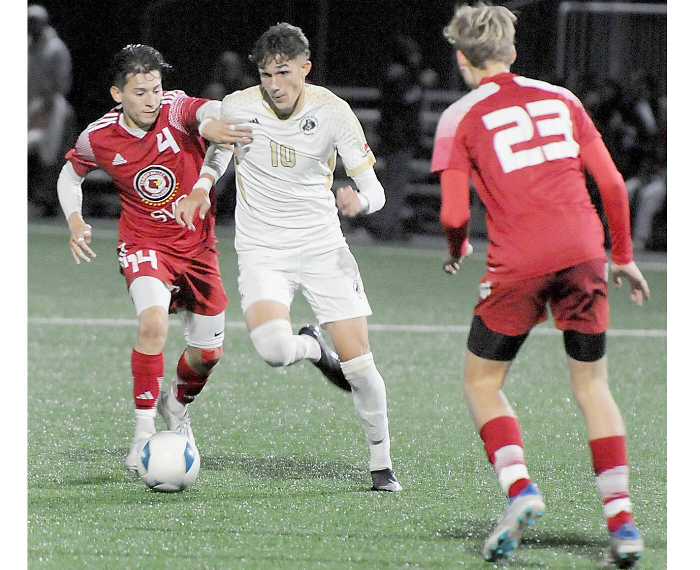 KEITH THORPE/PENINSULA DAILY NEWS
Peninsula's Nil Grau, center, fights off Skagit Valley's Fernando Velazquez at Peninsula College's Wally Sigmar Field last season. Grau, who scored eight goals last year for the Pirates, returns for his sophomore season this year.