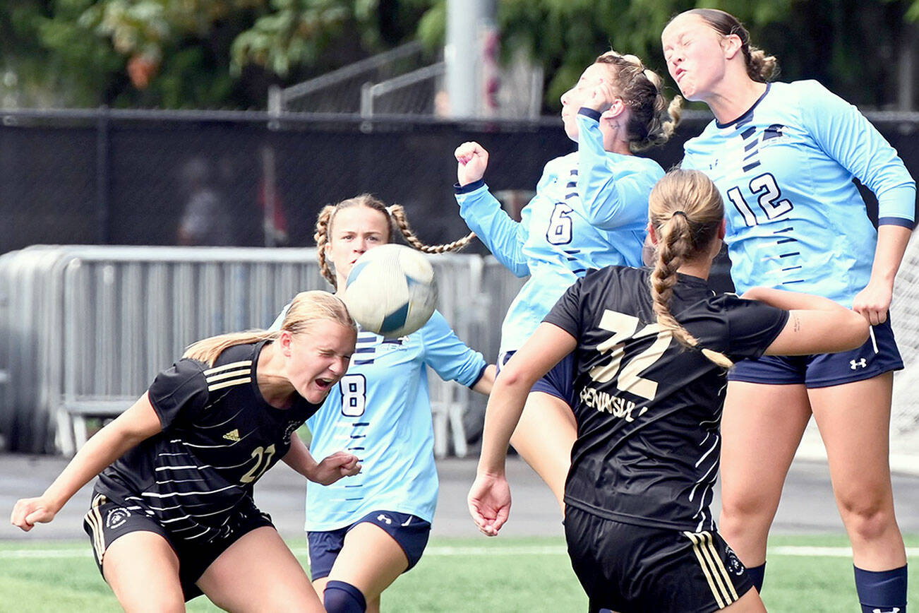 Rick Ross/Peninsula College Athletics
Peninsula College's Lauren Lases heads the ball while surrounded by a host of Columbia Basin defenders and teammate Gemma Rowland during the Pirates' 3-0 win over the Hawks at the NWAC Friendlies in Tukwila.