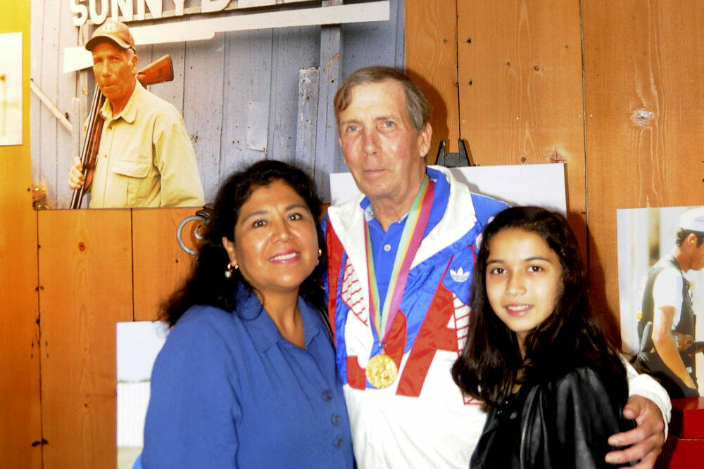 Matt Dryke, 1984 Olympic Games gold medal winner (skeet shooting), joins his wife Yvonne and daughter Ellen at the opening of the new Sequim Museum & Arts building in July 2019. A section of the museum details Dryke's storied career in the sport. Sequim Gazette file photo by Michael Dashiell