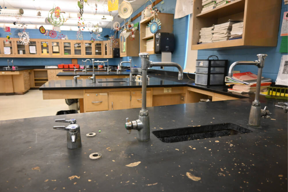 Members of the Sequim School District’s long-range facilities planning group got a look at Sequim High School’s aging science classrooms. The four classrooms were built in 1967. Adjacent to the classrooms is a storage area with rows of chemicals used in classroom studies without nearly the ventilation needed, said Mike Santos, Sequim schools’ director of facilities, operations and security. (Michel Dashiell/Olympic Peninsula News Group)