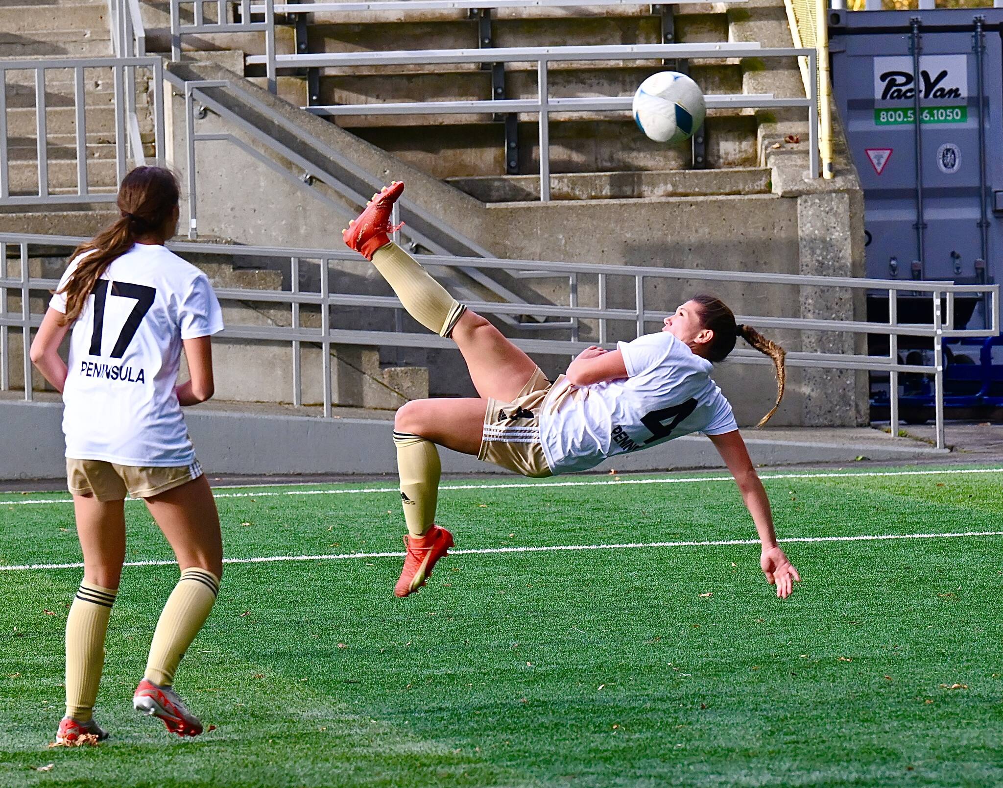 Peninsula’s Shawna Larson attempts a bicycle kick during the first half of the Pirates’ NWAC semifinal win over Spokane. Larson, the NWAC’s leading scorer, had an assist in the team’s victory.